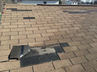 Wind damage shingles