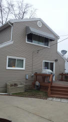 Vinyl siding and cloth awning